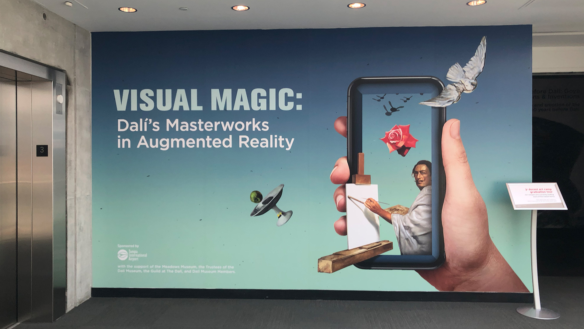 The sign for "Visual Magic: Dali's Masterpieces in Augmented Reality"