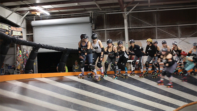 Roller Derby team doing a lap around the track