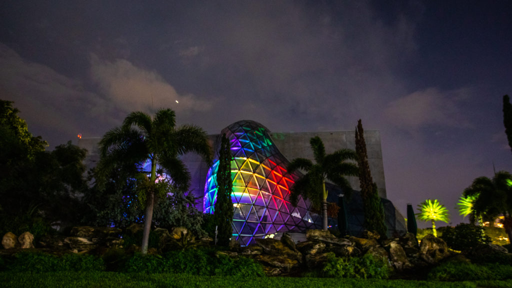 Exterior of the Dali Museum with a large glass atrium with rainbow lights