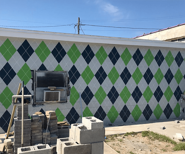 A green and blue argyle mural
