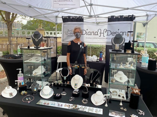 A fine artist displaying an assortment of jewelry