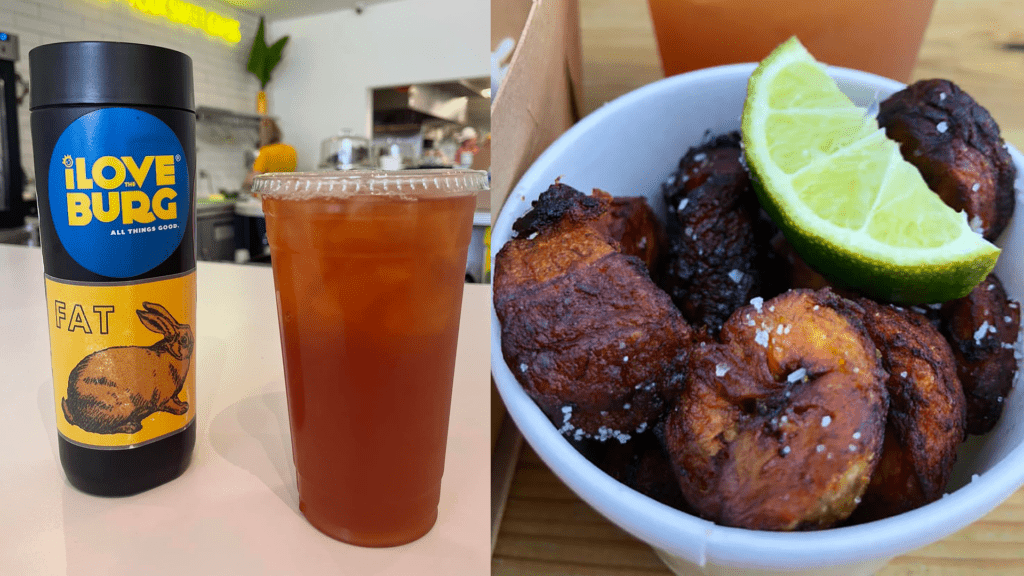 Two cups on a white table. One is a black tumbler, the other is a plastic cup filled with iced tea. To the right is a cup of salted sweet plantains. 