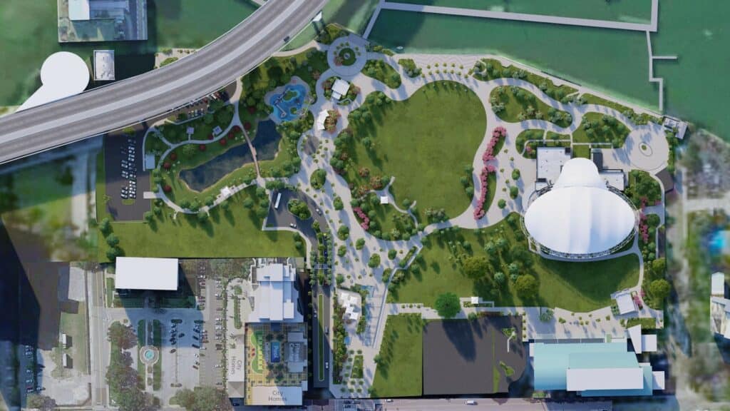 Aerial rendering of a new waterfront park and performing arts center. Trees are dotted throughout the venue, and a covered amphitheater is visible. 