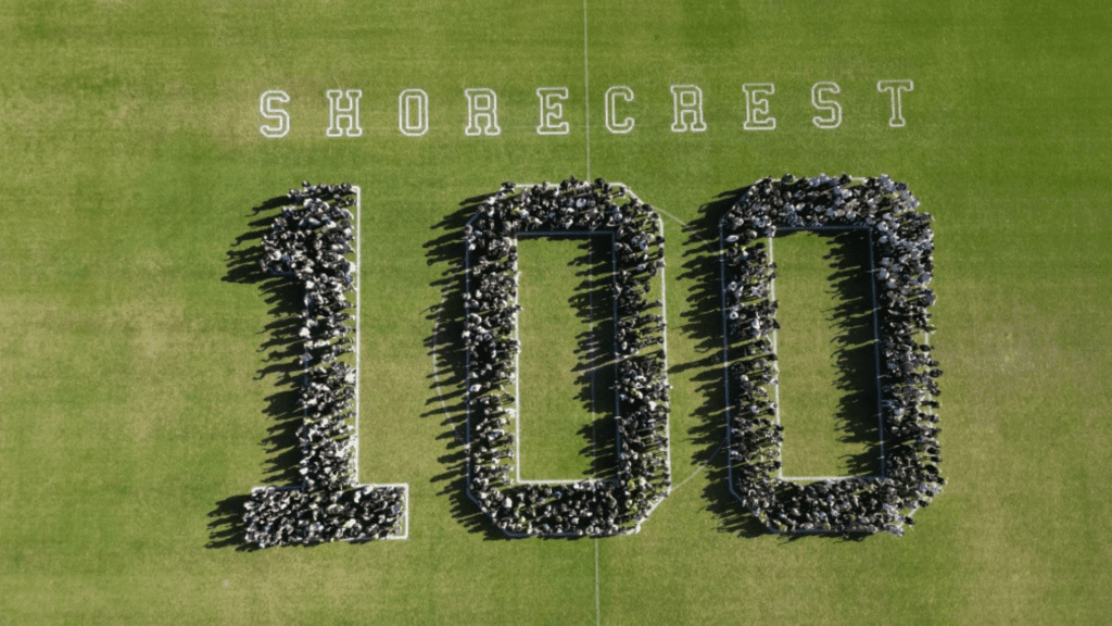 Students and staff spelling out 100 at Shorecrest
